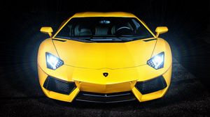 Preview wallpaper lamborghini, yellow, sports car, headlight, front view