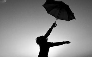 Preview wallpaper man, silhouette, jump, umbrella, black and white